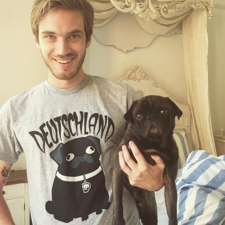 PewDiePie holding black pug