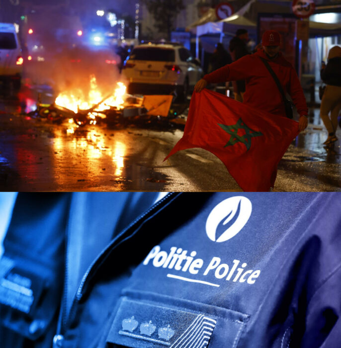 Incendio en la vía pública de Bruselas en Bélgica un aficionado con bandera marroquí y el logo de la policía belga